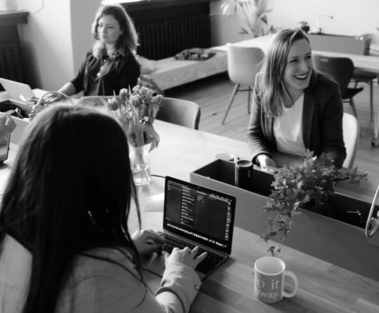 staff on work desk, chatting