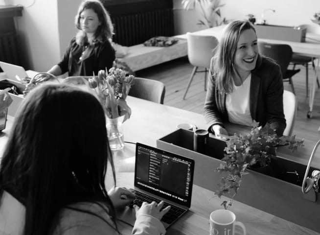 staff on work desk, chatting